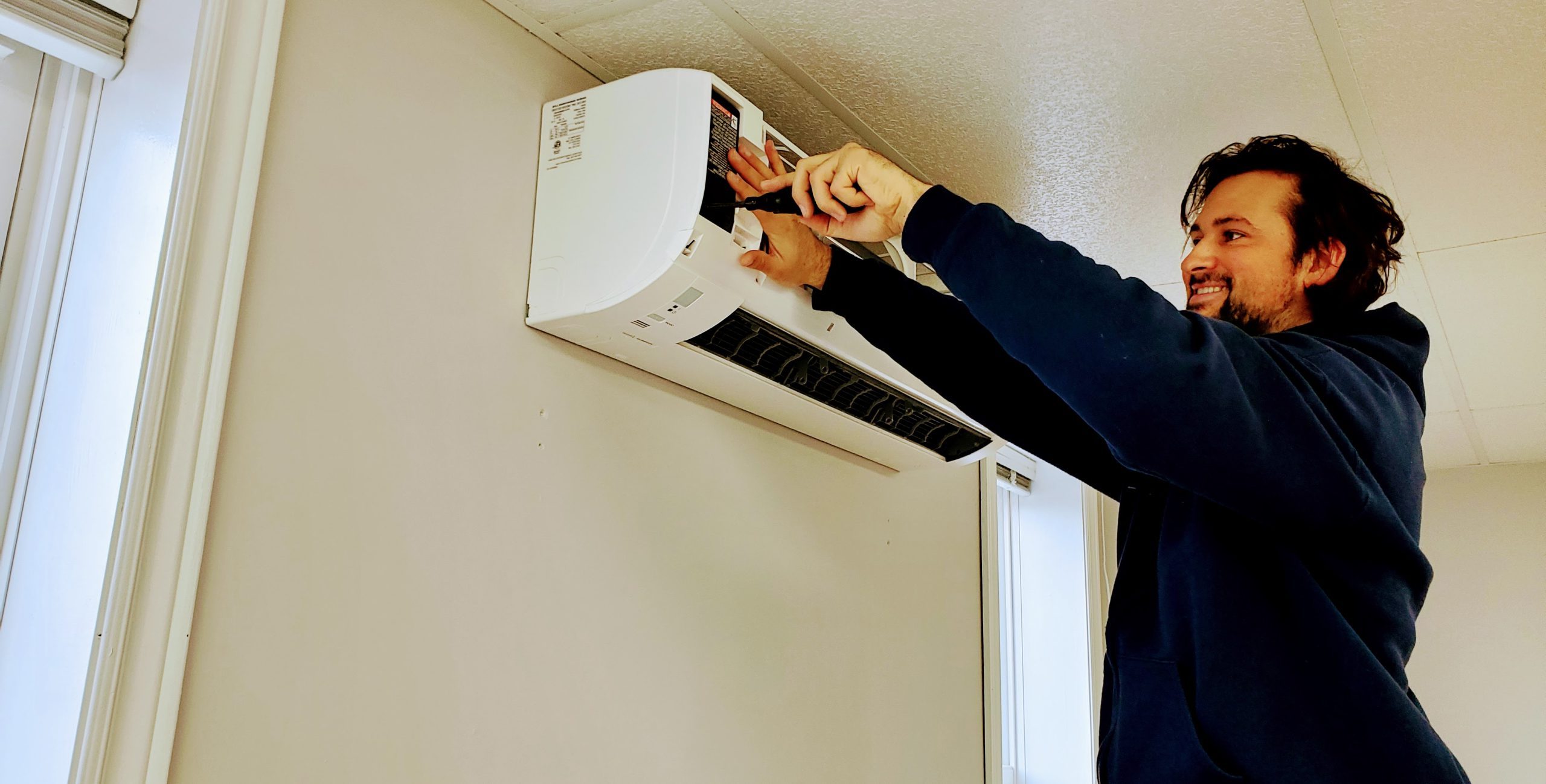Pure Air Cleaning technician servicing a mini split heat pump Nova Scotia